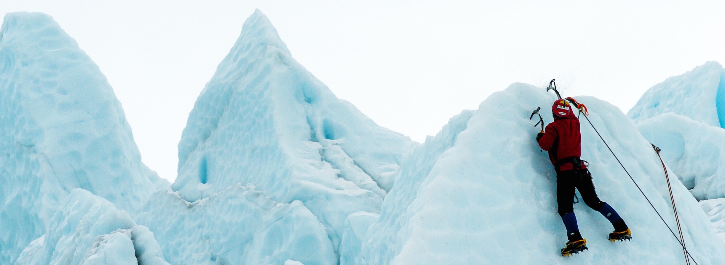 A man climbing an ice mountain